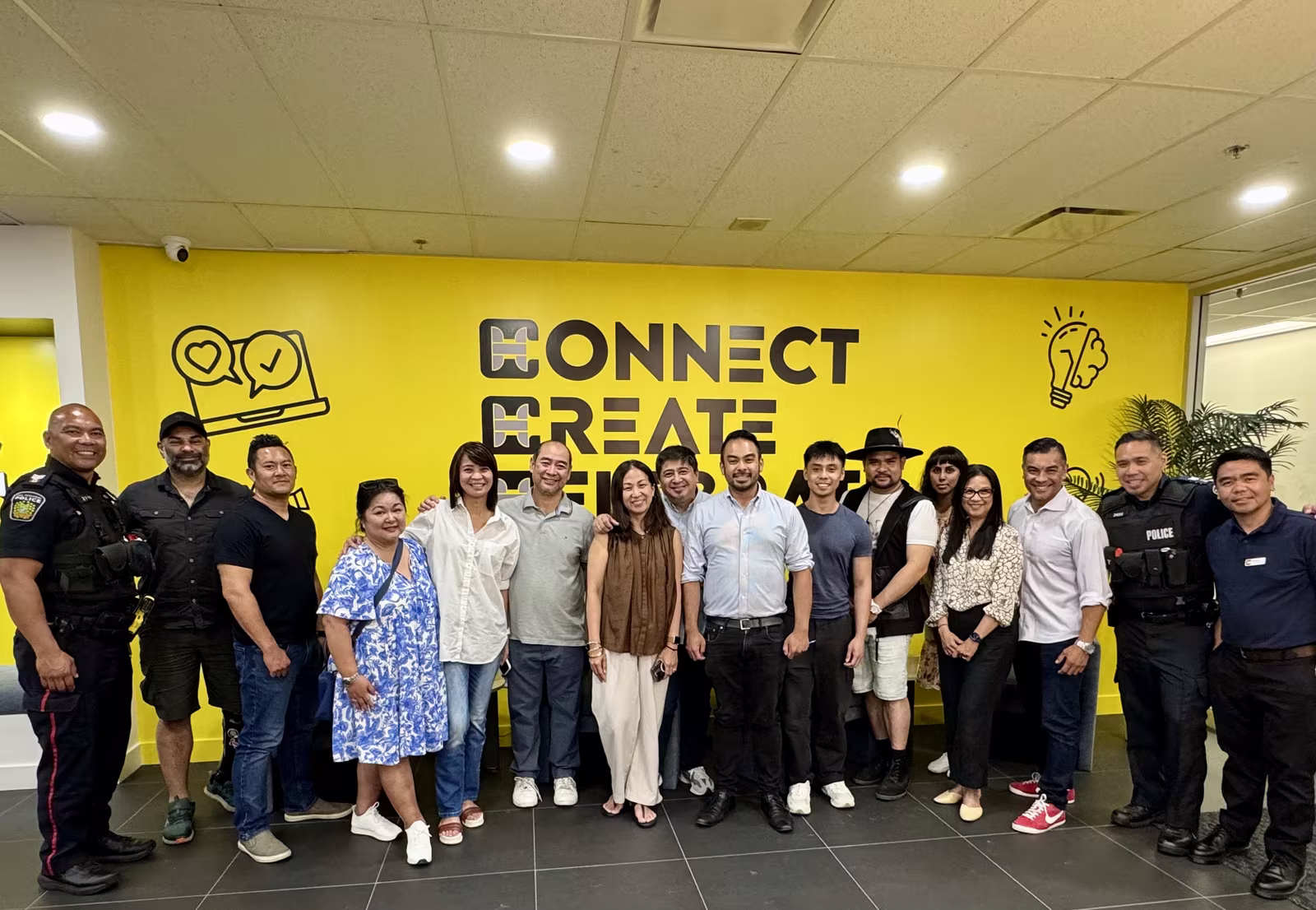 Gerald Adad with Peel Regional Police officers and community members at a Connect Create Elevate event